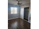 Bedroom features wood flooring, closet, and window with natural lighting at 4300 N Lamont St # 249, Las Vegas, NV 89115