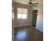 Cozy bedroom with hardwood floors, a ceiling fan, a large window, and closet at 4300 N Lamont St # 249, Las Vegas, NV 89115