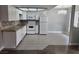 Well-lit kitchen with granite countertops, modern lighting, and tile floors at 4300 N Lamont St # 249, Las Vegas, NV 89115