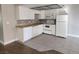 Bright kitchen with white cabinets, tile flooring, and stainless steel appliances at 4300 N Lamont St # 249, Las Vegas, NV 89115