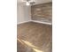 Spacious living room featuring wood flooring, ceiling fan, and modern accent wall at 4300 N Lamont St # 249, Las Vegas, NV 89115