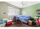 Bedroom featuring green painted walls, window, and carpeted floor at 4323 E Twain Ave, Las Vegas, NV 89121