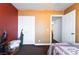 Bedroom showcasing neutral-colored walls, carpeted floor, and a closet with a vacuum cleaner at 4323 E Twain Ave, Las Vegas, NV 89121