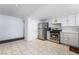 Functional kitchen with stainless steel appliances, white cabinetry, and tile flooring, offering a practical cooking space at 4323 E Twain Ave, Las Vegas, NV 89121