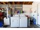 Laundry area featuring a washing machine, dryer, and water heater at 4323 E Twain Ave, Las Vegas, NV 89121