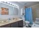 Bathroom featuring double sinks, modern fixtures, and tile surround shower at 4461 Greenhill Dr, Las Vegas, NV 89121
