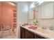Bathroom featuring a double sink vanity, tile floors, and a shower/tub combination at 4461 Greenhill Dr, Las Vegas, NV 89121