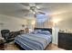Cozy bedroom with a ceiling fan and comfortable furniture at 4461 Greenhill Dr, Las Vegas, NV 89121