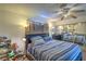 Bedroom featuring a mirror sliding closet, neutral decor, and comfortable furniture at 4461 Greenhill Dr, Las Vegas, NV 89121