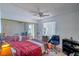 Cozy bedroom with mirrored closet and ceiling fan providing ample space at 4461 Greenhill Dr, Las Vegas, NV 89121