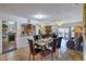 Open dining area featuring a glass-top table, tile floors, and seamless flow to the living space at 4461 Greenhill Dr, Las Vegas, NV 89121