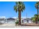Charming single-story home featuring desert landscaping and an attached two-car garage at 4461 Greenhill Dr, Las Vegas, NV 89121