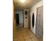 Hallway with neutral paint and tile flooring that leads to living spaces at 4461 Greenhill Dr, Las Vegas, NV 89121