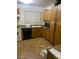 Bright kitchen featuring plenty of oak cabinets and countertop space with appliances at 4461 Greenhill Dr, Las Vegas, NV 89121