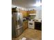 Functional kitchen features stainless steel refrigerator and standard appliances at 4461 Greenhill Dr, Las Vegas, NV 89121