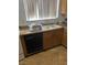 Functional kitchen featuring a stainless steel dishwasher and double sink at 4461 Greenhill Dr, Las Vegas, NV 89121