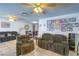 Relaxing living space showcasing tile flooring, comfortable seating, and a bright, open ambiance at 4461 Greenhill Dr, Las Vegas, NV 89121