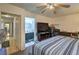 Well-lit bedroom with ensuite bathroom, TV, and neutral decor at 4461 Greenhill Dr, Las Vegas, NV 89121