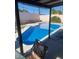 Inviting pool area under a shaded patio, perfect for outdoor relaxation and entertainment at 4461 Greenhill Dr, Las Vegas, NV 89121