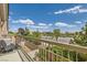 Relaxing balcony with a chair overlooking a serene landscape and community parking with blue skies at 4521 Bell Cord Ave # 103, North Las Vegas, NV 89031