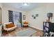 Bright bedroom with comfortable seating, natural light, and minimalist decor at 4521 Bell Cord Ave # 103, North Las Vegas, NV 89031