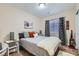 Bedroom with neutral decor, patterned curtains, and ample natural light at 4521 Bell Cord Ave # 103, North Las Vegas, NV 89031
