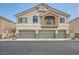 Charming two-story home with a three-car garage and neutral stucco exterior at 4521 Bell Cord Ave # 103, North Las Vegas, NV 89031