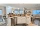 Contemporary kitchen featuring stainless steel appliances, white cabinets, and an open layout to living spaces at 4521 Bell Cord Ave # 103, North Las Vegas, NV 89031