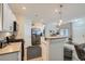 Well-equipped kitchen with stainless steel appliances, white cabinets, and seamless access to the living area at 4521 Bell Cord Ave # 103, North Las Vegas, NV 89031