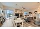 Cozy living room featuring a fireplace, ceiling fan, and a sliding door for outdoor access at 4521 Bell Cord Ave # 103, North Las Vegas, NV 89031