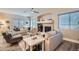 Inviting living room with neutral tones, a cozy fireplace, and large windows for natural light at 4521 Bell Cord Ave # 103, North Las Vegas, NV 89031
