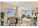 Stylish living room featuring a modern dining area and comfortable seating arrangement at 4521 Bell Cord Ave # 103, North Las Vegas, NV 89031