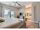 Bright main bedroom showcasing a serene view, neutral decor, and a ceiling fan at 4521 Bell Cord Ave # 103, North Las Vegas, NV 89031
