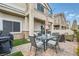 Back patio with brick paving, a grill, outdoor seating, and covered area with view of the home at 4521 Bell Cord Ave # 103, North Las Vegas, NV 89031