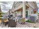 Back patio featuring brick paving, a grill, an air conditioner, outdoor seating, and a covered area at 4521 Bell Cord Ave # 103, North Las Vegas, NV 89031