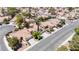 An aerial view showing the neighborhood of single-Gathering homes with terracotta tile roofs at 4521 Crimson Leaf Dr, Las Vegas, NV 89130