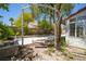 Outdoor swing set with a view of the yard and adjacent white-walled property at 4521 Crimson Leaf Dr, Las Vegas, NV 89130