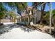 Backyard with mature trees provides shade for the patio and swing set at 4521 Crimson Leaf Dr, Las Vegas, NV 89130
