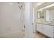 Well-maintained bathroom with tiled shower, granite countertop vanity, and a bright, clean aesthetic at 4521 Crimson Leaf Dr, Las Vegas, NV 89130