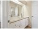 Bathroom featuring a granite countertop vanity, elegant glass bowl sink, and bright mirror at 4521 Crimson Leaf Dr, Las Vegas, NV 89130