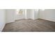 Spacious carpeted bedroom with ample natural light from large window and bright white walls at 4521 Crimson Leaf Dr, Las Vegas, NV 89130