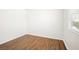 Bright bedroom features wood-look floors and natural light from the window at 4521 Crimson Leaf Dr, Las Vegas, NV 89130