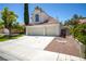 Charming home with a two-car garage, tile roof and well-maintained landscaping at 4521 Crimson Leaf Dr, Las Vegas, NV 89130
