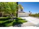 Inviting home with beautiful landscaping and a well-maintained lawn at 4521 Crimson Leaf Dr, Las Vegas, NV 89130