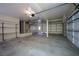 Three-car garage is clean with ample space and built-in shelving for storage at 4521 Crimson Leaf Dr, Las Vegas, NV 89130