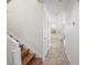 Hallway with tile flooring leads to an open living space, with stairs visible to the left at 4521 Crimson Leaf Dr, Las Vegas, NV 89130