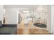 This virtually staged kitchen has stainless steel appliances, granite countertops, and island, open to a dining area and fireplace at 4521 Crimson Leaf Dr, Las Vegas, NV 89130