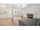 Spacious living room with fireplace and view to sun room and backyard at 4521 Crimson Leaf Dr, Las Vegas, NV 89130