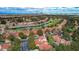 Stunning aerial shot of the community featuring a golf course, serene pond, and meticulously kept landscaping at 5112 Onion Creek Ln, Las Vegas, NV 89113
