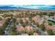 Scenic aerial view of a neighborhood with beautiful homes, mature trees, and well-maintained streets at 5112 Onion Creek Ln, Las Vegas, NV 89113